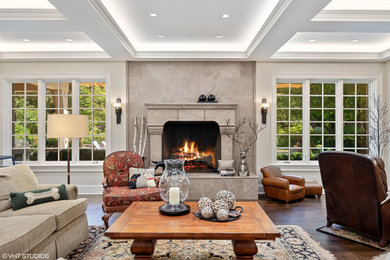 Large trendy open concept dark wood floor, brown floor and coffered ceiling family room photo in Chicago with a standard fireplace and a stone fireplace