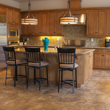 Interior remodel including flooring, stone wall, and lighting.