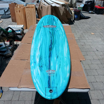 Ron Jon surfboard table for outside poolside beverage hut