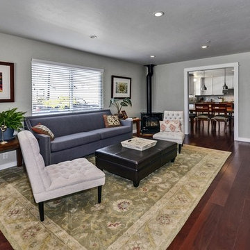Second living room view with glimpse of kitchen and dining area