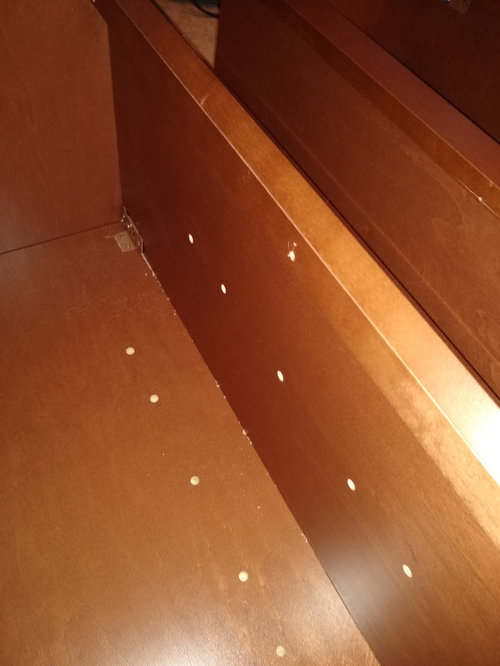 Attaching face frame of diagonal corner cabinet to straight cabinet ...