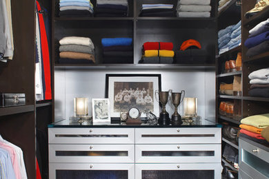 Inspiration for a large contemporary men's dark wood floor and brown floor walk-in closet remodel in Detroit with open cabinets and dark wood cabinets