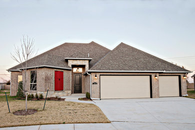 Inspiration for a large transitional beige one-story brick exterior home remodel in Oklahoma City