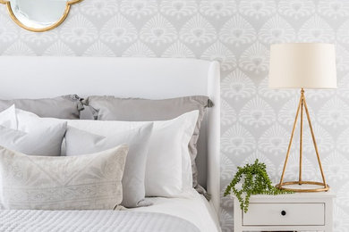 Example of a transitional bedroom design in Other with gray walls