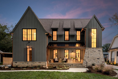 Example of a mid-sized minimalist gray two-story mixed siding and board and batten exterior home design in Charlotte with a shingle roof