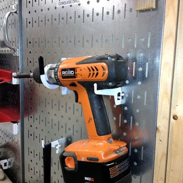 This customer created a "pegboard door" out of two Wall Control metal pegboards
