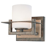 Minka Lavery - Sconce Wall Light with White Glass in Aged Patina Iron Finish - This one-light rustic style sconce is a fabulous lighting fixture from Minka Lighting. It features a gorgeous travertine stone backplate that is accented by the steel frame and base finished in aged patina iron. The cylindrical etched opal glass shade completes its transitional look. The fixture will nicely fit in a variety of decor as it carries a mixed look comprising of modern, classic, and rustic styles. Measured as 5-1/-inches in width by 5-1/4-inches in height, this sconce will make a bright addition to your hallway or study.