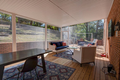 Mid-sized elegant screened-in back porch photo with decking and a roof extension