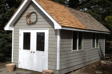 Example of a mid-sized cottage shed design in Other