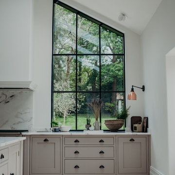 Olive - Kitchen overview with crittall windows and garden views.