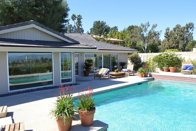 Inspiration for a huge coastal backyard rectangular aboveground pool remodel in Los Angeles