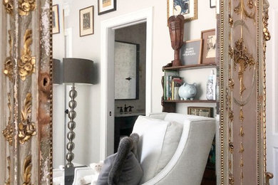 Example of a mid-sized transitional gender-neutral dark wood floor and brown floor nursery design in Atlanta with gray walls