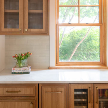 Warm Modern Kitchen Renovation with Natural Oak & Green Accents