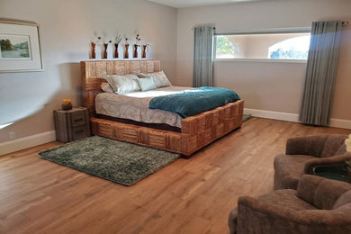 Bedroom - mid-sized coastal master porcelain tile and brown floor bedroom idea in Denver with brown walls and no fireplace