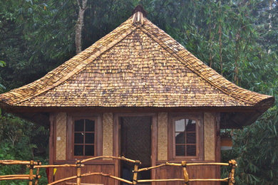 Example of a one-story wood exterior home design in Other