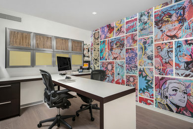 Minimalist built-in desk home office photo in Chicago with white walls