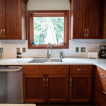 Custom Cherry Kitchen Cabinets with Beaded Inserts, Quartz Countertop
