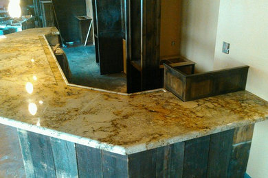 Example of a wet bar design in Other with granite countertops
