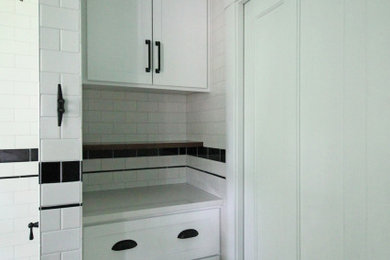 Example of a mid-sized arts and crafts white tile and subway tile mosaic tile floor, white floor and single-sink shower curtain design in Chicago with beaded inset cabinets, medium tone wood cabinets, a two-piece toilet, green walls, an undermount sink, quartz countertops, gray countertops and a niche