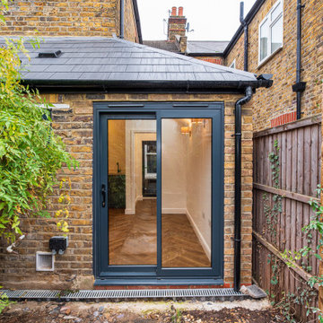 Modern Wraparound Kitchen Extension with Steel Blue Design in West London