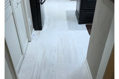 Inspiration for a kitchen in Jacksonville with porcelain floors and white floor.