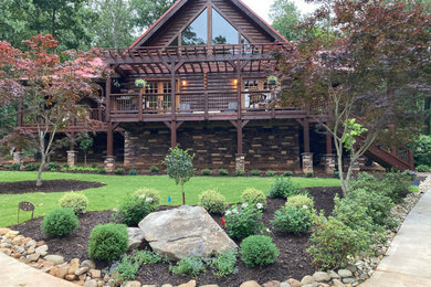 This is an example of a large rustic front yard landscaping in Other.