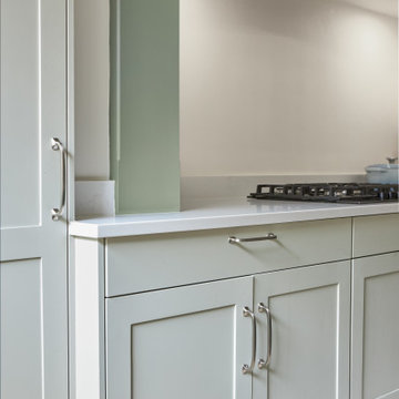 Capri White Gemini Quartz worktops with sage green cabinetry
