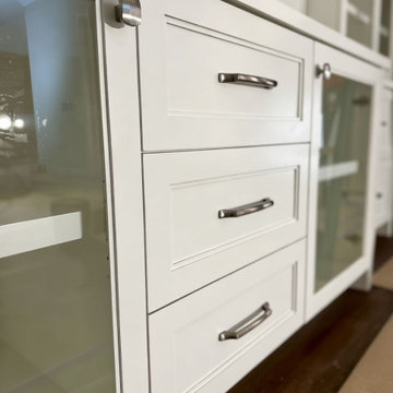Custom Built-In Media Wall with Glass Display Cabinets