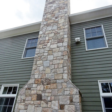 Combining Colonial Tan Natural Stone with Olive Green Siding
