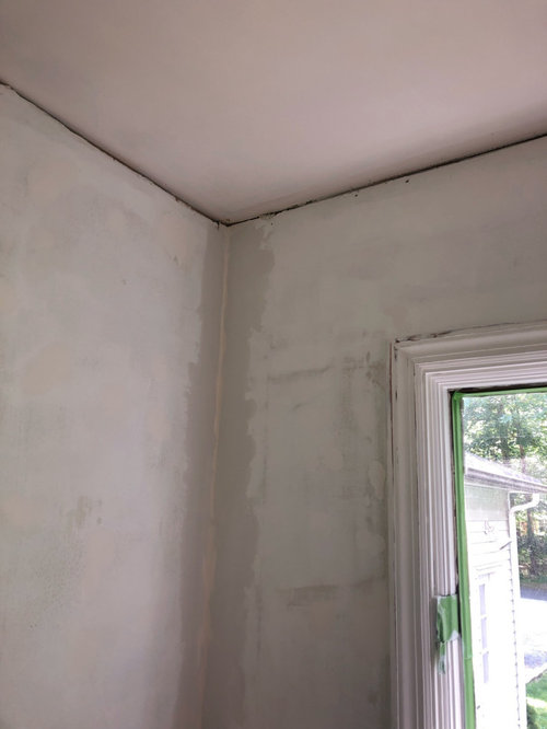 taping drywall where walls meet ceiling