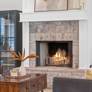 Cozy Modern Farmhouse Living Room: Stone Fireplace, Vaulted Ceilings, Loft Libra