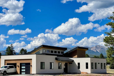 Example of a trendy home design design in Albuquerque
