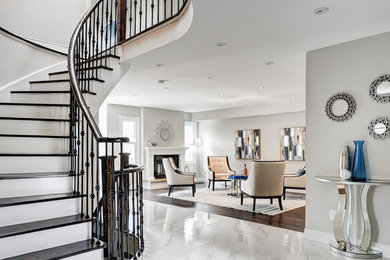 Inspiration for a large transitional marble floor and white floor hallway remodel in Toronto with gray walls