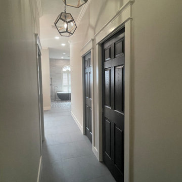 Hallway to Bath (closet doors and toilet room)