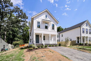 Example of a small arts and crafts white two-story concrete fiberboard and board and batten exterior home design in DC Metro with a shingle roof and a gray roof
