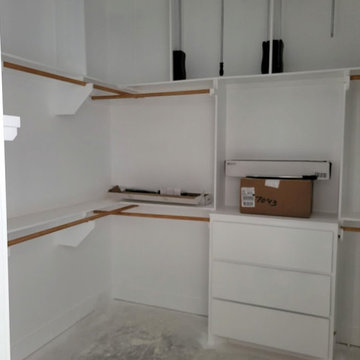 Custom Walk-In Closet with Pull-Down Rods & Built-In Drawer Unit