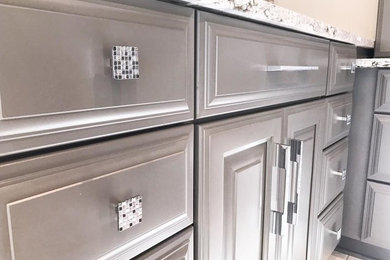Inspiration for a large contemporary master white tile and subway tile marble floor and white floor bathroom remodel in Indianapolis with gray cabinets, a one-piece toilet, gray walls, a drop-in sink, quartz countertops, a hinged shower door and white countertops