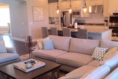 Mid-sized transitional open concept dark wood floor and brown floor family room photo in Tampa with beige walls