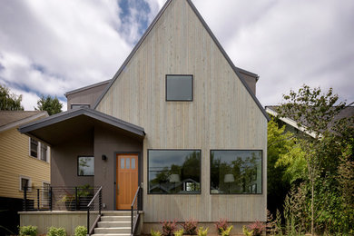 Trendy gray two-story wood exterior home photo in Seattle