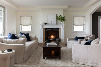 Transitional dark wood floor and brown floor living room photo in San Francisco with beige walls and a standard fireplace