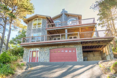 Inspiration for a large rustic multicolored three-story mixed siding exterior home remodel in Seattle