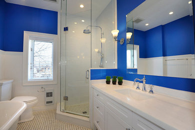 Inspiration for a mid-sized contemporary master bathroom in Toronto with shaker cabinets, white cabinets, a claw-foot tub, a corner shower, a two-piece toilet, blue walls, porcelain floors and an undermount sink.