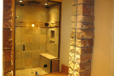 Inspiration for a mid-sized country master bathroom in Denver with a corner shower, beige tile, ceramic tile, beige walls, ceramic floors, a vessel sink, wood benchtops, beige floor and a hinged shower door.