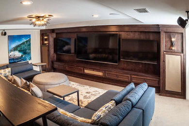 Inspiration for a contemporary beige floor home theater remodel in Grand Rapids with a media wall