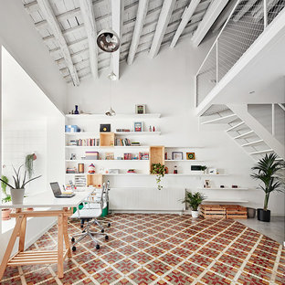This is an example of a large scandinavian study room in Barcelona with white walls, ceramic floors, no fireplace and a built-in desk.