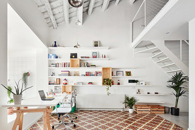 Large danish built-in desk ceramic tile study room photo in Barcelona with white walls