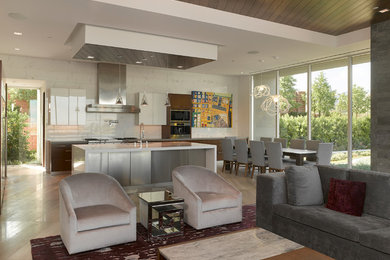 Inspiration for a large contemporary open concept porcelain tile family room remodel in Las Vegas with white walls