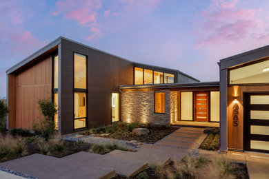Example of a trendy brown exterior home design in Other