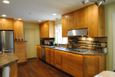 Eat-in kitchen - large contemporary u-shaped dark wood floor eat-in kitchen idea in Cleveland with shaker cabinets, medium tone wood cabinets, multicolored backsplash, stainless steel appliances, no island, a drop-in sink, granite countertops and matchstick tile backsplash