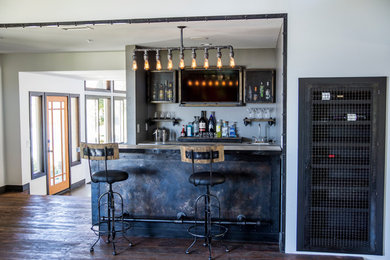 Inspiration for an industrial home bar remodel in Orange County